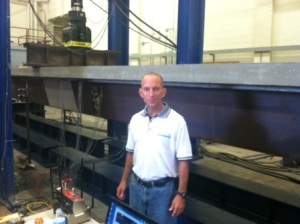 Dr. Karl Barth conducts a test on the new shallow steel press-brake tub girder technology.